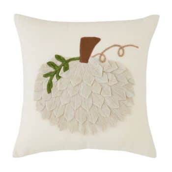 A square throw pillow featuring an embroidered white pumpkin design with a brown stem and green leaves on a light background.