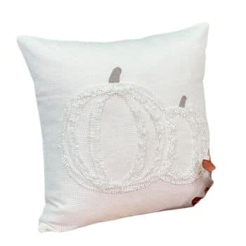 A white decorative pillow featuring a textured embroidery of two pumpkins. The pumpkins are outlined in a neutral color, adding a subtle autumn theme to the design.