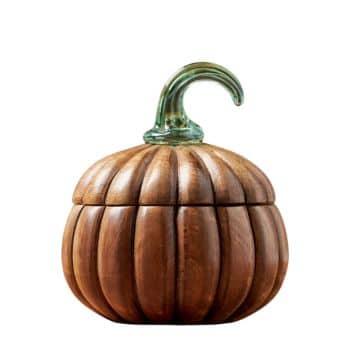 A wooden pumpkin-shaped container with a ribbed design and a green glass stem on top.