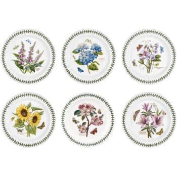 A set of six decorative plates, each featuring a different botanical illustration. The designs include flowers such as lavender, hydrangeas, sweet peas, sunflowers, roses, and magnolias, each surrounded by green leaf patterns on the rim.