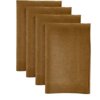 Four brown linen napkins neatly stacked in a row against a white background.