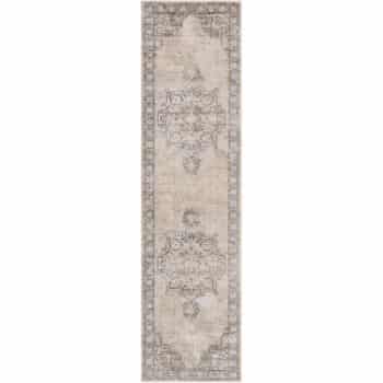 A long, narrow, vintage-style rug with a faded ornamental pattern in muted tones of beige and gray. The design features a central medallion with intricate detailing and a decorative border.