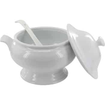 A white ceramic soup tureen with a matching lid and a ladle resting inside. The tureen has two side handles and is placed on a flat surface with the lid slightly tilted to the side.