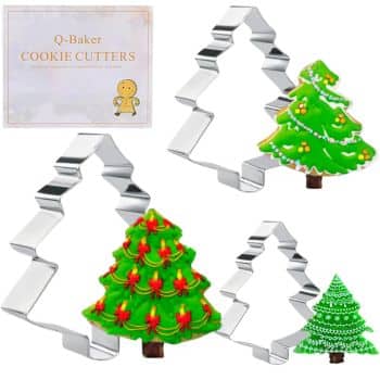 Five cookie cutters in various Christmas tree shapes are displayed alongside beautifully decorated cookies, acclaimed as the best Christmas cookies. A label in the top left corner reads "Q-Baker Cookie Cutters," complemented by a small gingerbread icon.