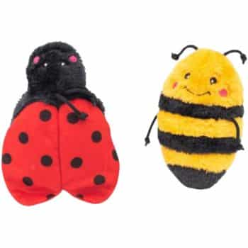 Two plush toys: a ladybug with a black head, red wings with black spots, and a bee with yellow and black stripes, both smiling with pink cheeks.