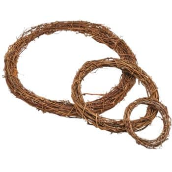 Three natural grapevine wreaths of varying sizes are arranged on a white background, showcasing their rustic, intertwined branches—perfect for inspiring elegant Christmas crafts for adults.