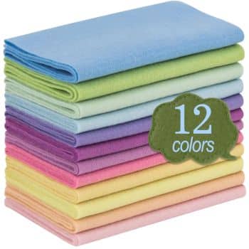 A stack of colorful felt sheets in various pastel shades, perfect for Christmas crafts for adults, includes blue, green, pink, and yellow. A green cloud-shaped label reads "12 colors.