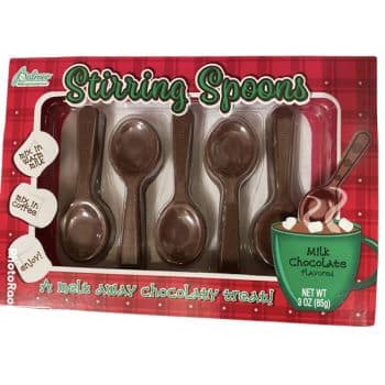 Box of five chocolate stirring spoons labeled "Stirring Spoons" with instructions to mix in milk or coffee. The box also features an image of a mug of hot chocolate. Net weight: 3 oz (85g).