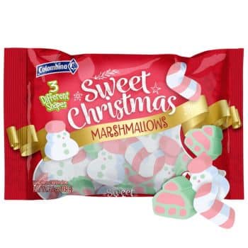 A festive red package of Colombina Sweet Christmas Marshmallows featuring 3 different shapes. The marshmallows are pastel-colored, shaped like candy canes, snowmen, and Christmas trees.