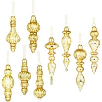 A collection of nine gold ornament-shaped decorations with a shiny finish. The designs vary, featuring both round and elongated shapes, each with a loop for hanging.