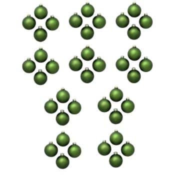 A collection of small green decorative ornaments arranged in groups, resembling geometric patterns on a white background.