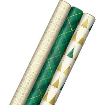 Three rolls of wrapping paper: one with a cream geometric pattern and gold stars, another in green with gold diamond patterns, and the last in white with alternating green and gold Christmas trees.