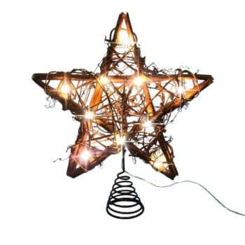 A star-shaped tree topper made of intertwined twigs, wrapped with glowing string lights, sits on a coiled spring base. The design is rustic and festive, with an electrical cord trailing off to the side.