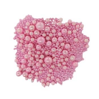 A textured cluster of various-sized pink beads resembling pearls, reminiscent of delicate pink desserts, is tightly arranged to form an abstract, irregular shape. The beads have a shiny surface, adding a reflective quality to the overall composition.