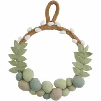 A decorative felt wreath with a loop at the top, this seasonal piece features green and beige leaves, white buds, and variously sized green and beige balls at the bottom, creating a nature-inspired design.