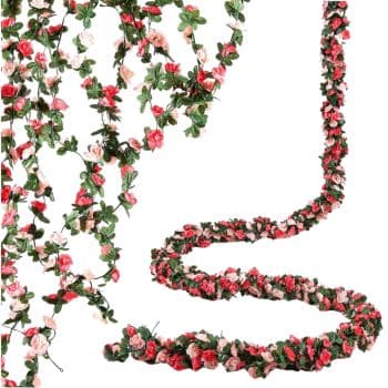 Artificial floral garlands with small red, pink, and white roses intertwined with green leaves, arranged in draping strands and a coiled pattern on a white background.