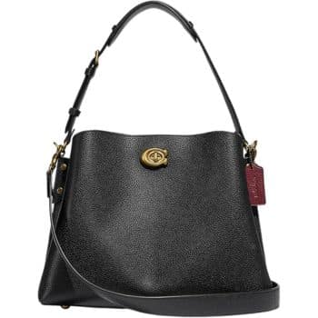 A stylish black leather handbag with a single adjustable strap and a gold turn-lock closure. It has a textured finish and a small red tag hanging from one side.