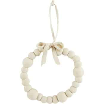 A seasonal wreath crafted from wooden beads, arranged in a circular pattern with varying sizes. It features a tied ribbon at the top for hanging. Both the beads and ribbon are light in color, imparting a natural look ideal for any season.