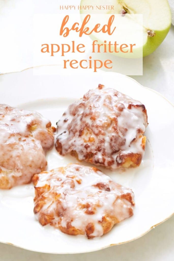 Three glazed apple fritters rest on a white plate, accompanied by a partially visible green apple. The delightful text above highlights the irresistible "Bake Apple Fritter Recipe.