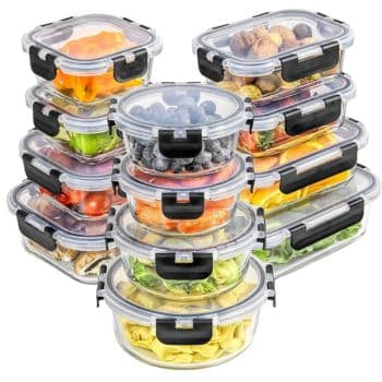 A stack of 12 clear plastic food storage containers with black latches, brimming with fruits, vegetables, and nuts. Perfect for those seeking professional organizing tips, these two columns showcase a neat and efficient way to store and display your pantry essentials.