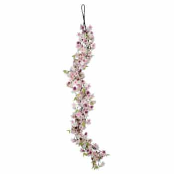 A long, decorative garland of pink and white flowers with green leaves, hanging on a loop. The flowers are arranged in a delicate, wavy pattern, creating a festive appearance.