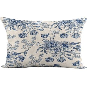 A rectangular pillow featuring a delicate blue floral pattern on a white background. It showcases intricate designs of flowers and leaves, giving a classic and elegant appearance.