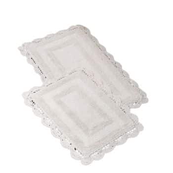 Two white crochet lace placemats with scalloped edges, arranged slightly overlapping on a white background. The intricate lace design creates a decorative and elegant appearance.