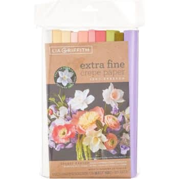 The Lia Griffith extra fine crepe paper "Secret Garden" package in various colors is perfect for easy flower paper crafts. The cover showcases a vibrant floral arrangement with white, pink, and orange flowers. The packaging is clear and resealable for convenience.