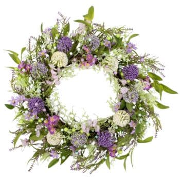 A circular floral wreath featuring a mix of purple, white, and pink flowers with green leaves and sprigs, creating an elegant natural arrangement. The center is empty, highlighting the fullness and texture of the surrounding blooms.