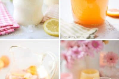 Discover the best summer drinks: A creamy beverage in a mason jar with a pink straw, an orange delight with a pink umbrella, a pitcher and glass of fruit-filled punch, and two glasses of purple smoothie topped with whipped cream. Refreshment awaits!.