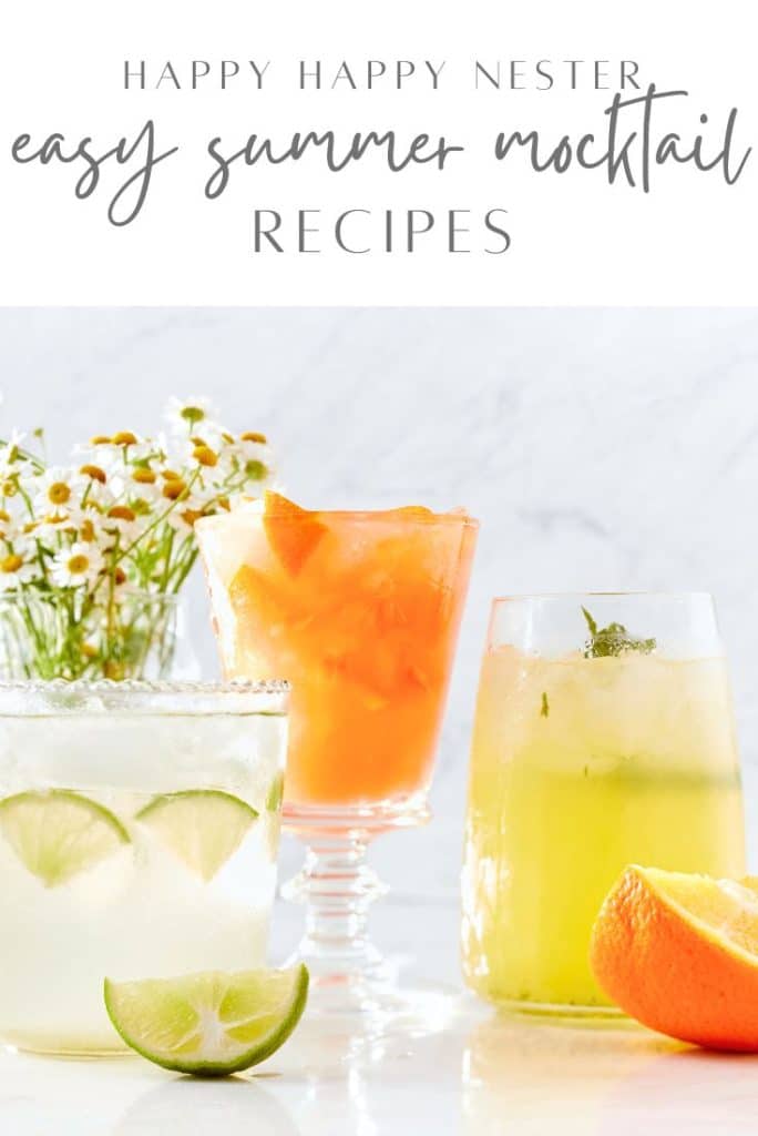 Three colorful mocktails are displayed: a lime drink with sliced limes and ice, a bright orange drink in a tall glass, and a light yellow drink garnished with mint. Chamomile flowers and citrus wedges decorate the table. Discover easy summer mocktail recipes for refreshing delights!.