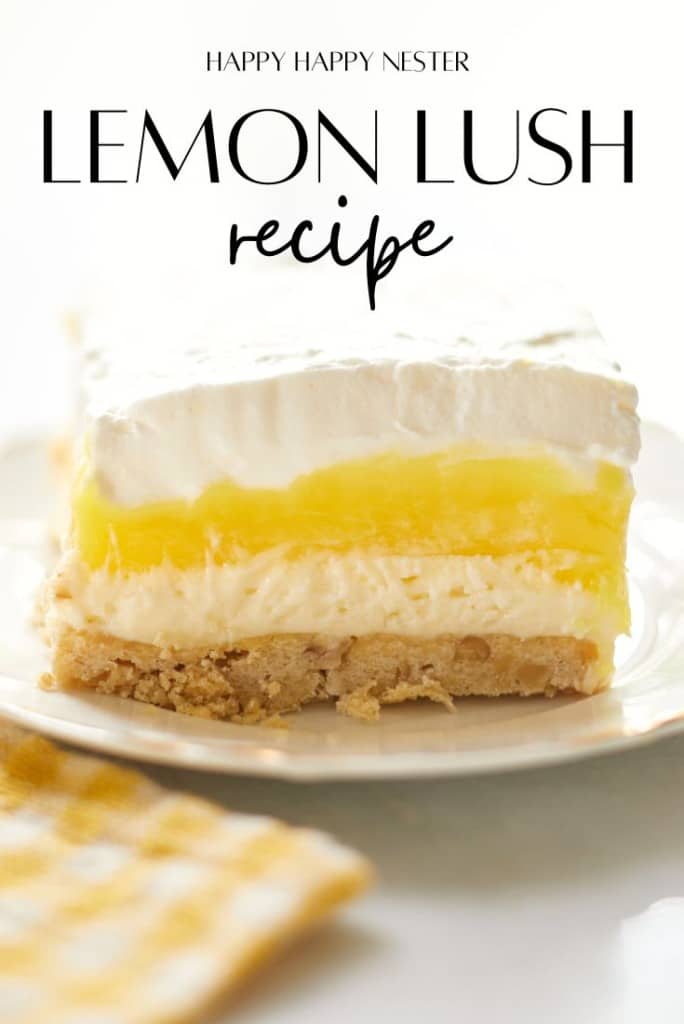 A close-up of a slice of lemon lush dessert on a white plate showcases layers of creamy filling, bright yellow lemon, and whipped topping on a crumbly base. Text above reads "Happy Happy Nester: Recipe for Lemon Lush Dessert.