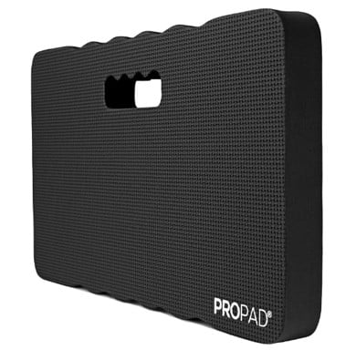 Black kneeling pad with a textured surface and rounded corners. It features an ergonomic handle cutout for easy carrying. The word "PROPAD" is printed in white on the bottom right corner.