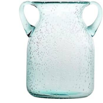 A transparent, light blue glass vase with two handles and a dotted texture, resembling small bubbles on its surface. The vase has a slightly rounded shape, giving it an elegant and simple appearance.