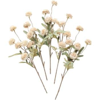 Artificial floral stems with cream-colored, round pom-pom flower heads and green leaves, arranged in a fan shape against a plain background.