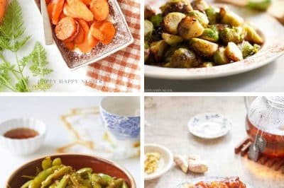 Four of my favorite easy side dishes on display: sliced carrots on a rectangular plate, roasted Brussels sprouts on a round plate, green beans in a brown bowl, and glazed chicken pieces on a blue-patterned plate. The background includes leaves, a teapot, and various condiments.