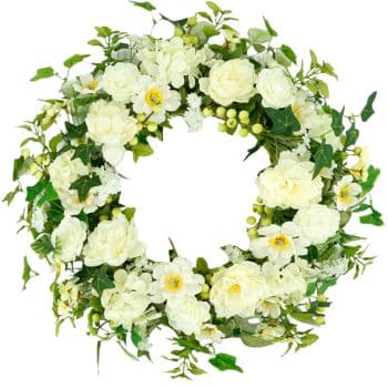 A circular wreath made of white flowers and green leaves, arranged symmetrically with a hollow center, set against a white background.
