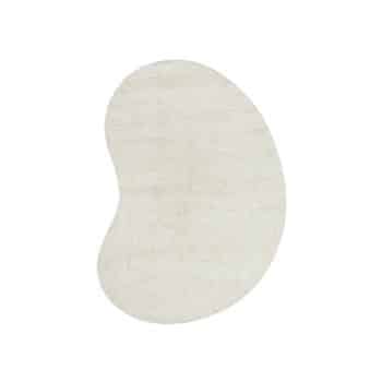 A light beige, kidney-bean-shaped rug with a soft texture, shown against a plain white background.