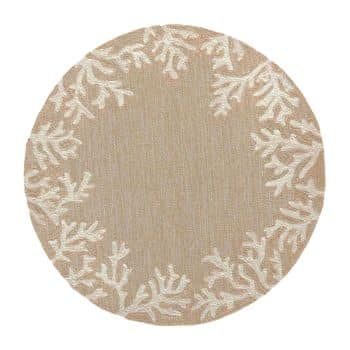 Round beige rug with a subtle pattern of white coral designs arranged in a circular border near the edge. The center of the rug is plain, without any additional decoration.