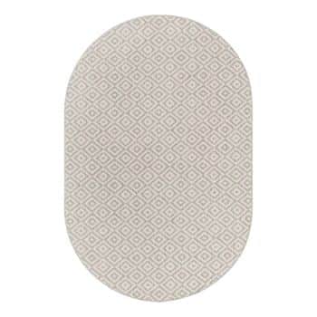 Oval-shaped area rug with a light beige background and a repeating diamond pattern in white. The design is simple and geometric, giving the rug a modern yet neutral appearance.