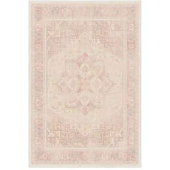 A rectangular, light-colored area rug with a faded, intricate geometric and floral pattern in soft pink, beige, and cream tones, creating a vintage or antique look.
