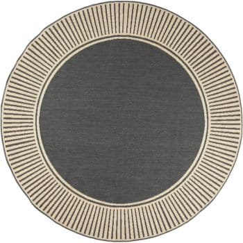 A round rug with a dark gray center and a wide beige border featuring evenly spaced, short black lines radiating outward, creating a sunburst or striped pattern around the edge.