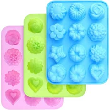 Three silicone molds in pink, green, and blue feature assorted shapes, including hearts, stars, and my favorite flower inspiration. Perfect for baking or making chocolates, each tray offers creative designs arranged in neat rows.