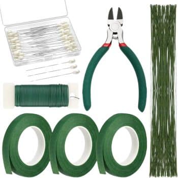 A set of floral arrangement tools, perfect for my favorite flower crafts, including green floral wire, tape, stem wires, wire cutters with green handles, pearl-tipped pins, and a box of straight pins—all neatly arranged on a white background.