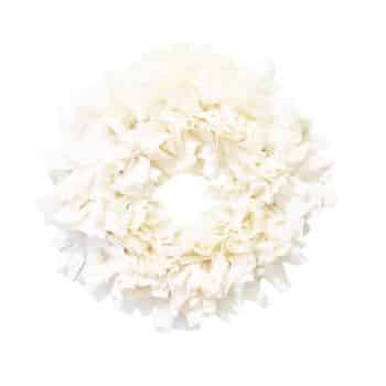 A wreath made of layered, ruffled white fabric pieces arranged in a circular shape, creating a soft and fluffy texture against a white background.