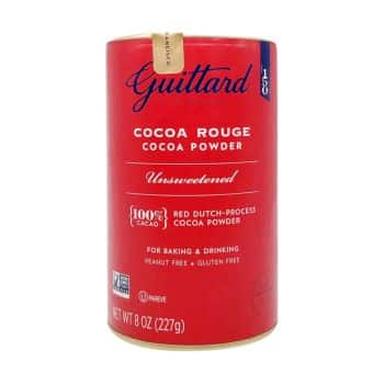 A red canister of Guittard Cocoa Rouge Unsweetened Cocoa Powder, labeled as 100% cacao, red Dutch-process, peanut free, gluten free—perfect for baking, drinking, and adding a rich touch to my favorite chocolate recipes. Net weight 8 oz (227g).