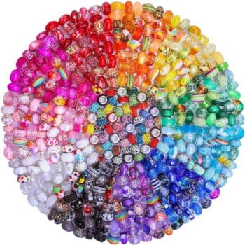 A circular arrangement of multicolored beads, organized in a gradient spectrum from red to purple, with various shapes and designs—a vibrant, rainbow-like pattern that's my favorite summer decor to make.