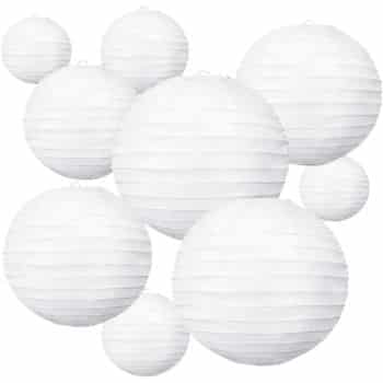 Several white paper lanterns of various sizes are clustered together against a plain white background. The lanterns have a ribbed texture and appear to be floating—my favorite summer decor to make for a light, airy feel.