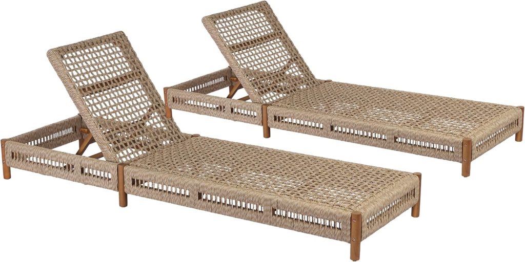 Two woven rattan outdoor lounge chairs with adjustable backrests and a natural wood frame offer flat, reclining comfort. Perfect for pairing with your favorite outdoor tables and chairs, they’re shown side by side on a white background.