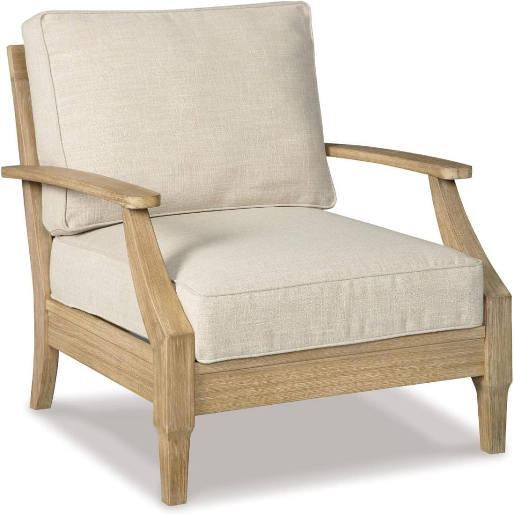 A wooden armchair with light beige cushions on the seat and backrest, featuring angled armrests and a sturdy, natural wood frame—perfect for pairing with outdoor tables and chairs.